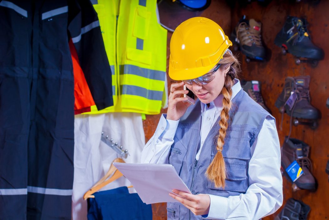 safety3 woman on a phone looking at paper